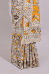 Yellow hand painted peacock & floral design kalamkari cotton saree with contrast border and floral printed blouse