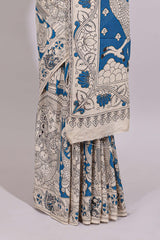 Blue hand painted peacock & floral design kalamkari cotton saree with contrast border and floral printed blouse