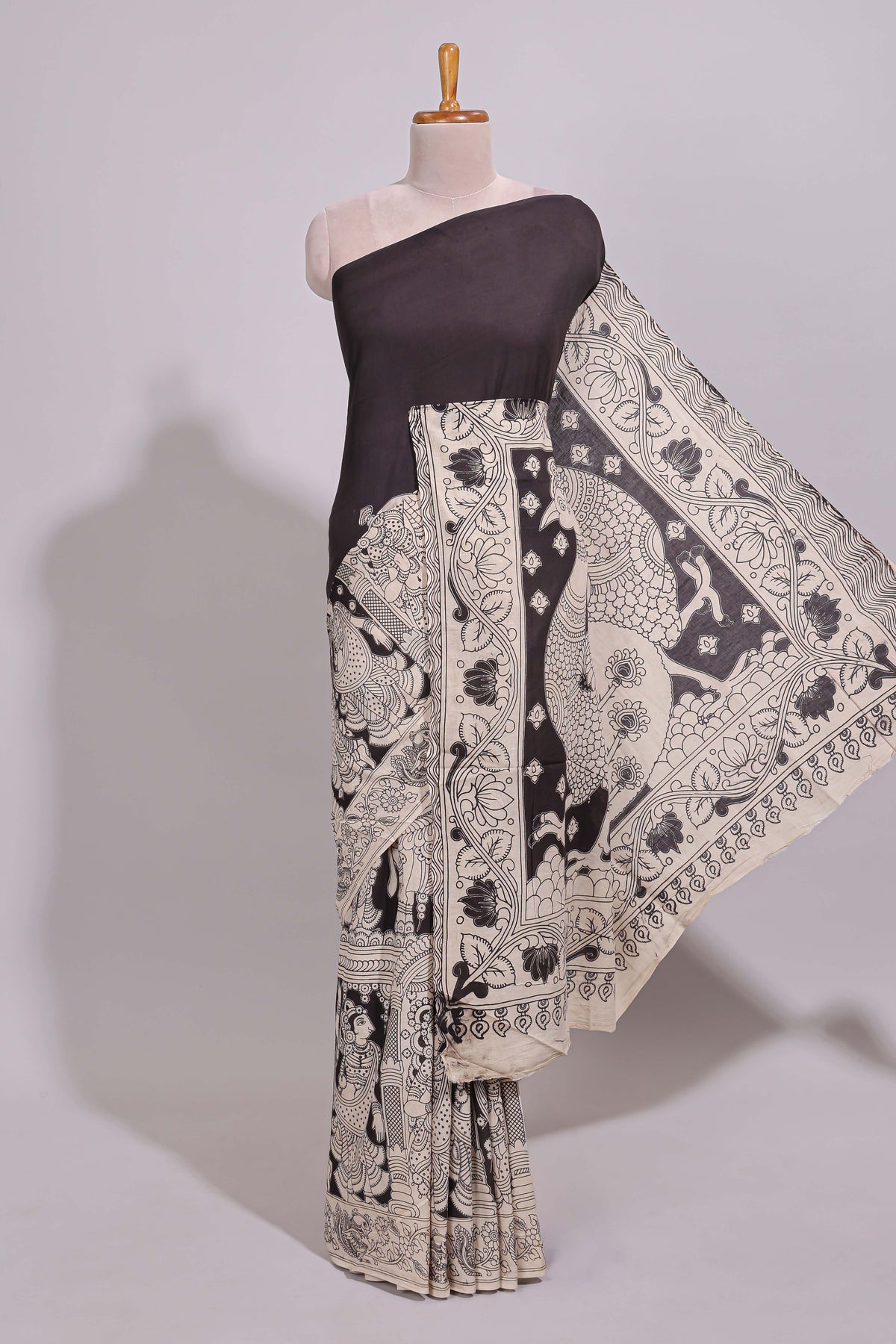 Black hand painted peacock & floral design kalamkari cotton saree with contrast border and floral printed blouse