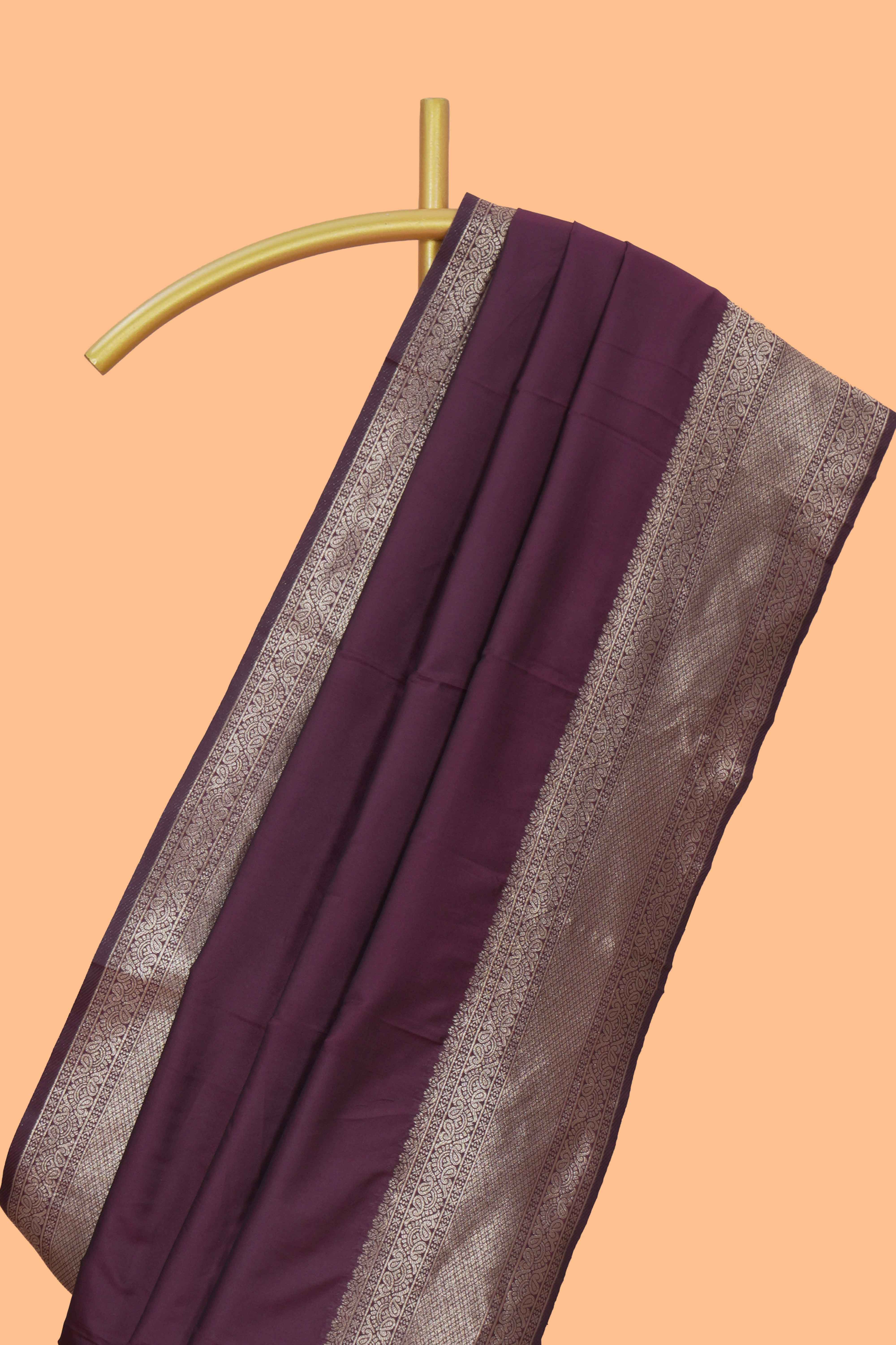 Deep purple plain kathan silk saree with self zari border and motifs blouse
