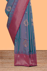 Dual tone teal blue and magenta kathan silk saree with contrast zari borders and motifs blouse