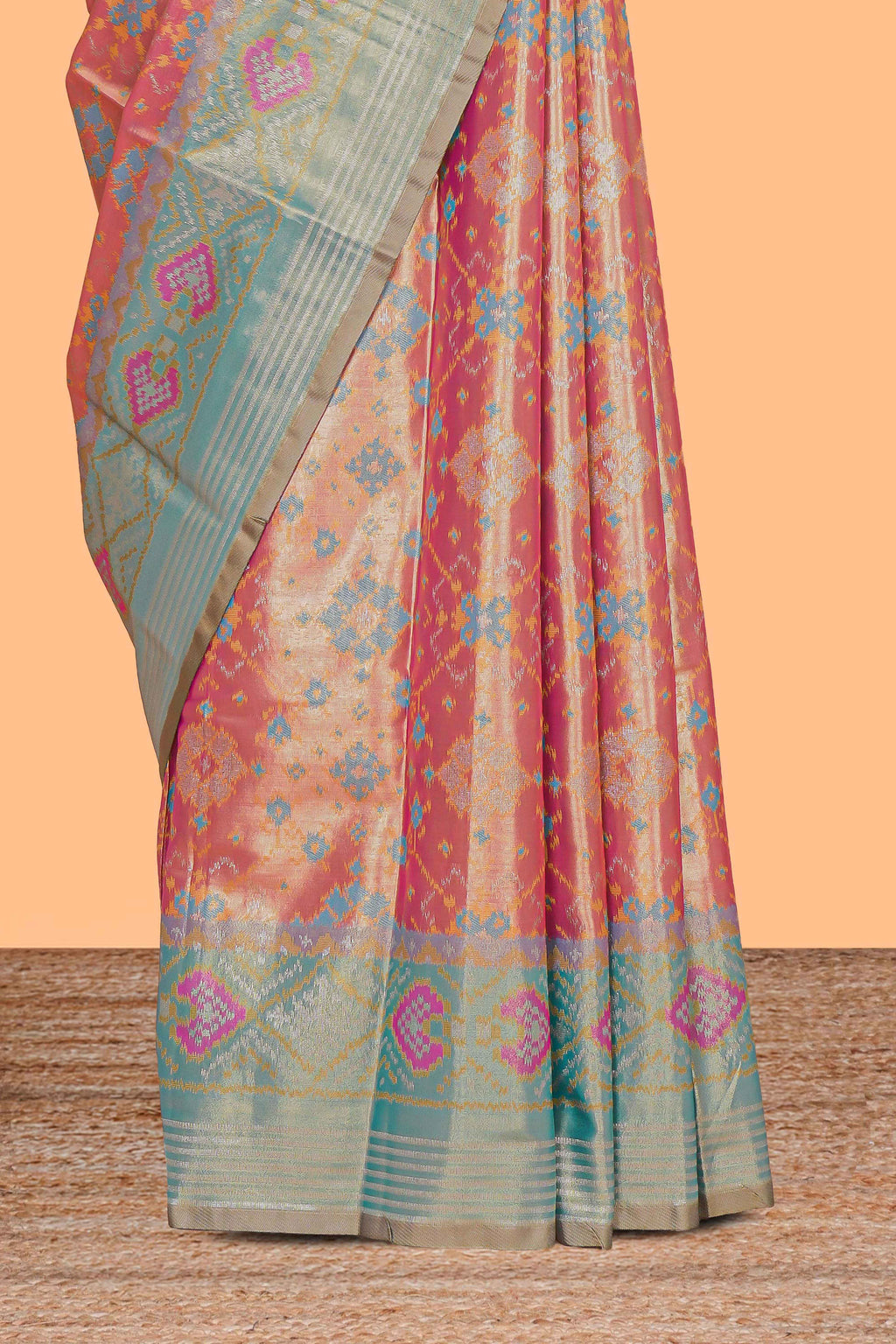 Peach ikkat design kathan silk saree with contrast borders and motifs blouse
