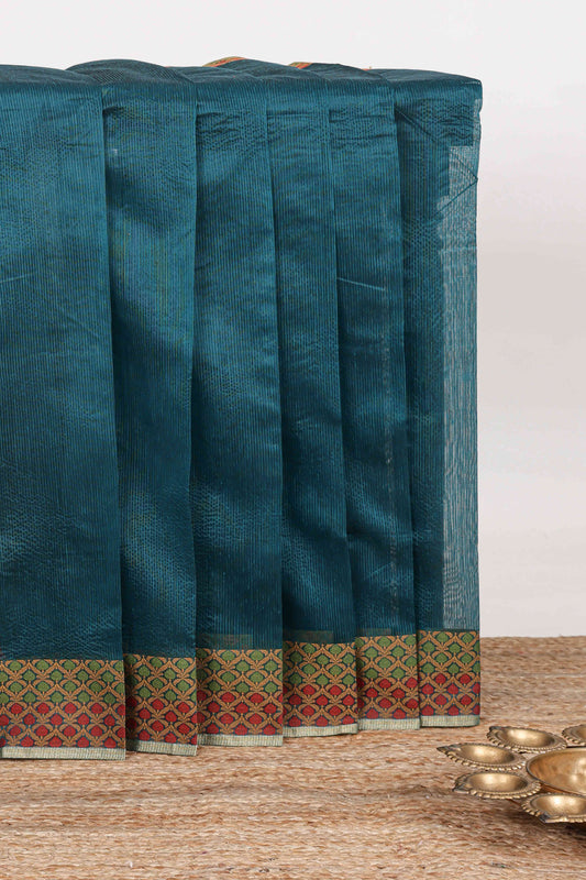 Midnight green plain kota cotton saree with contrast border and geometic floral design blouse