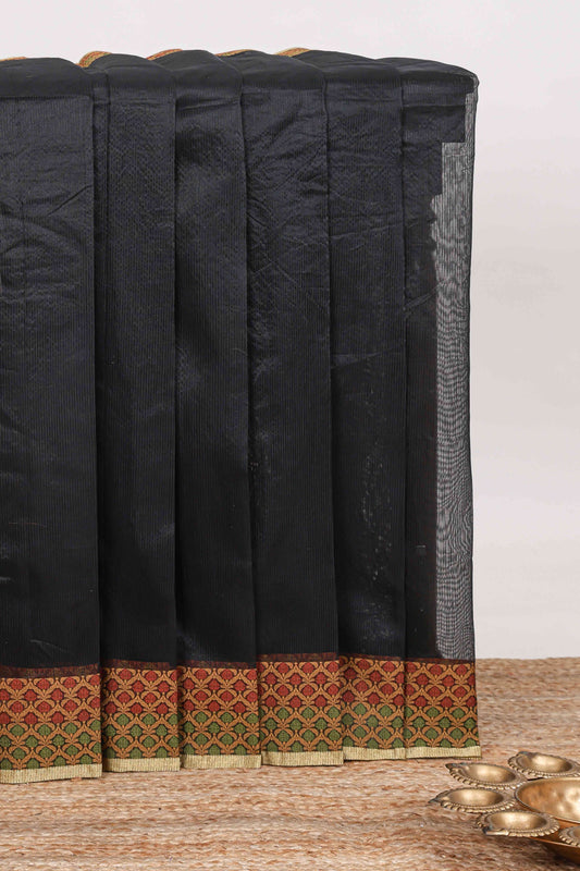 Black plain kota cotton saree with contrast border and geometic floral design blouse