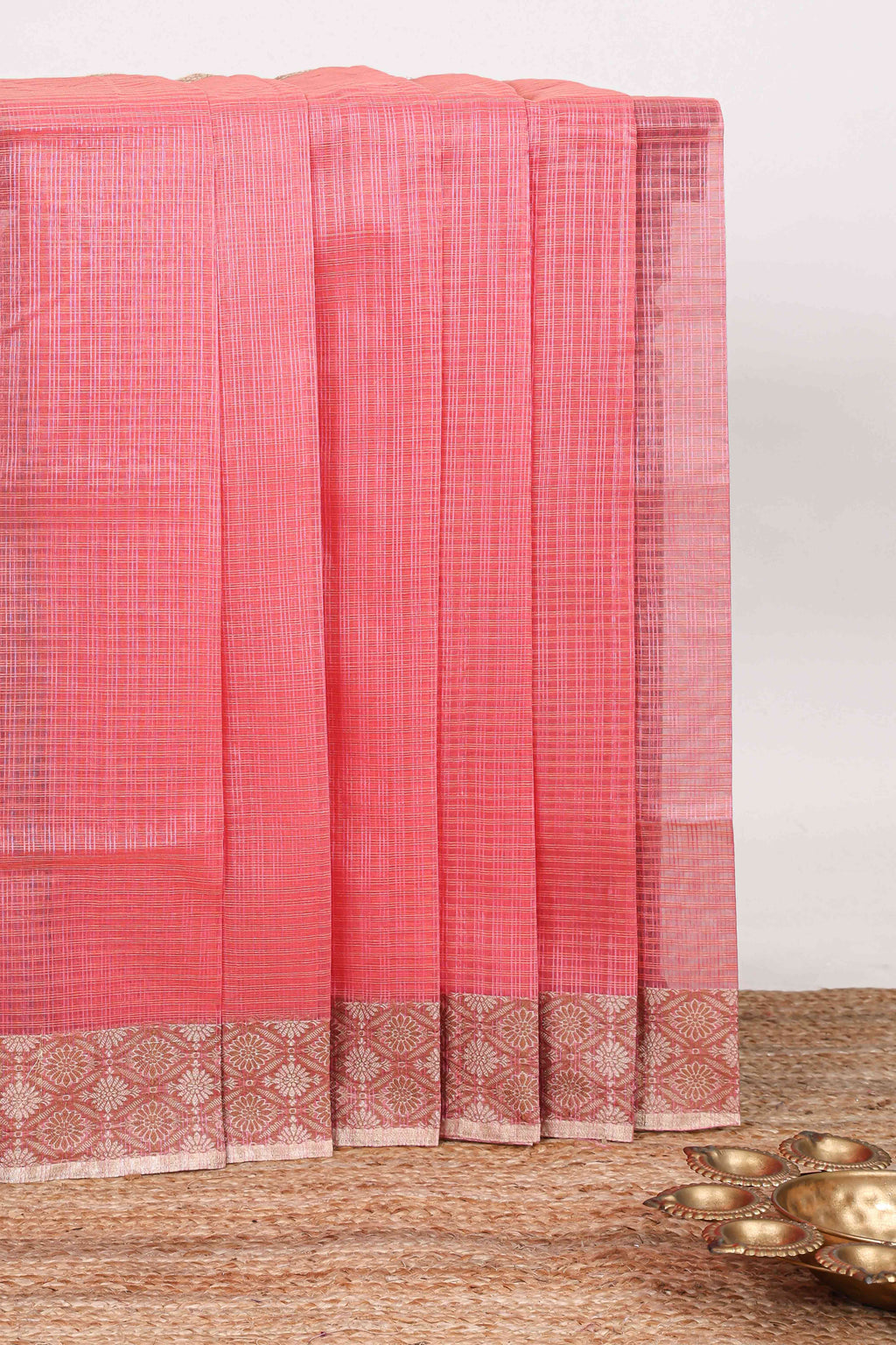 Pink checked kota cotton saree with contrast border and floral design blouse