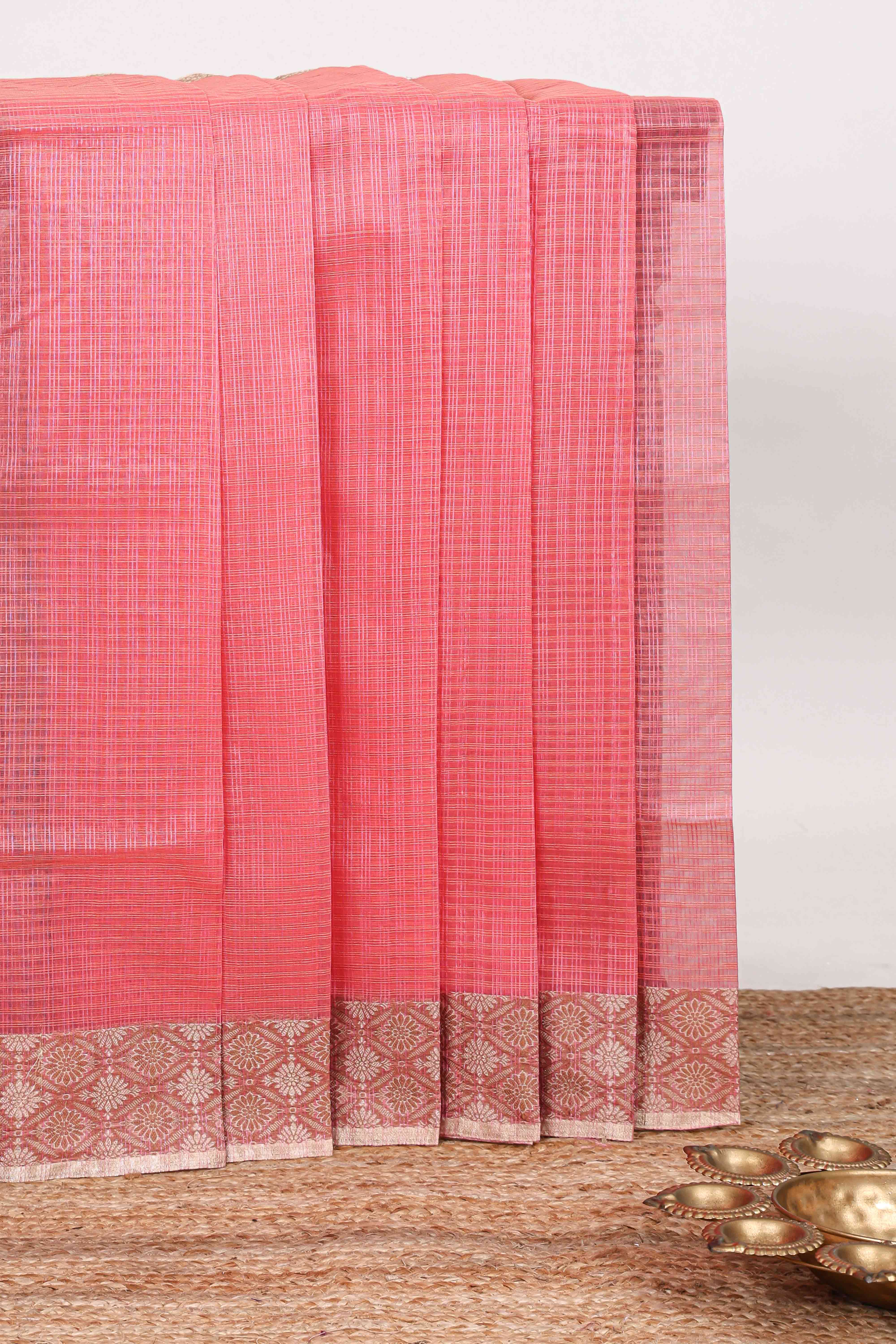 Pink checked kota cotton saree with contrast border and floral design blouse