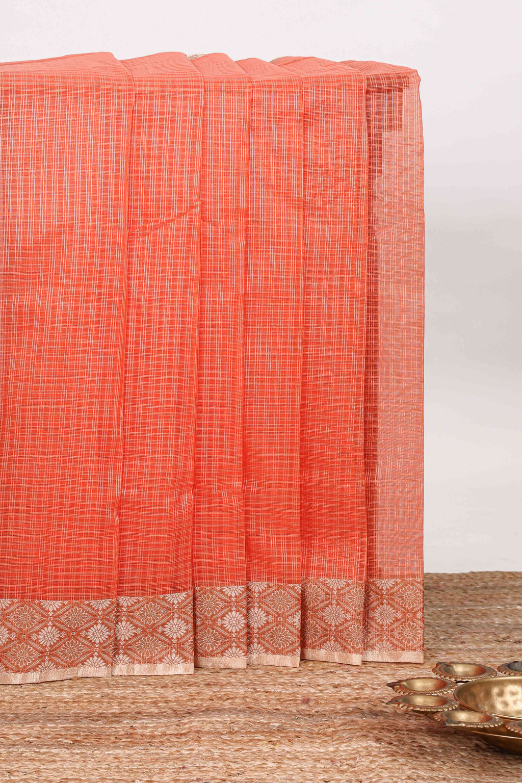 Orange checked kota cotton saree with contrast border and floral design blouse