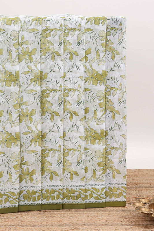 Cream floral design kota cotton saree with self border and matching print blouse