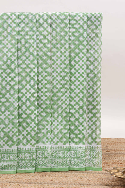 Green floral design kota cotton saree with self border and contrast floral print blouse