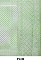 Green floral design kota cotton saree with self border and contrast floral print blouse