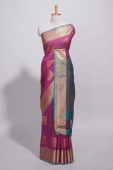 Rich magenta tussar saree with gold zari floral buttas teal zari border and woven zari pallu with contrast blouse piece