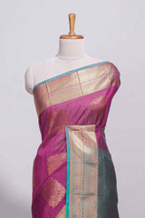 Rich magenta tussar saree with gold zari floral buttas teal zari border and woven zari pallu with contrast blouse piece