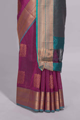 Rich magenta tussar saree with gold zari floral buttas teal zari border and woven zari pallu with contrast blouse piece