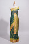 Dark teal green kotta cotton with gold zari buttas a zari border with temple design and zari woven pallu with matching blouse piece