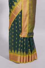 Dark teal green kotta cotton with gold zari buttas a zari border with temple design and zari woven pallu with matching blouse piece
