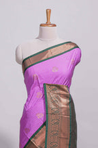 Purple colour kotta cotton saree with copper zari floral buttas a rich zari border and woven zari pallu with matching blouse piece