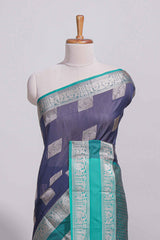 Navy blue tussar saree with silver zari square buttas retta petta zari border and woven zari pallu with contrast blouse piece