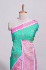 Aqua green kotta cotton saree with zari floral buttas a rich zari border and woven zari pallu with matching blouse piece