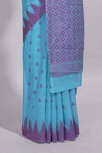 Sky blue Kotta cotton saree with woven buttas contrasting purple Ikat-inspired border and a geometric woven pallu with matching blouse