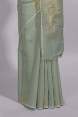 Pastel green Kotta saree with gold woven checks and buttawith rich gold zari woven pallu with matching blouse