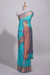Blue tussar saree with gold zari floral buttas teal zari border and woven zari pallu with contrast blouse piece