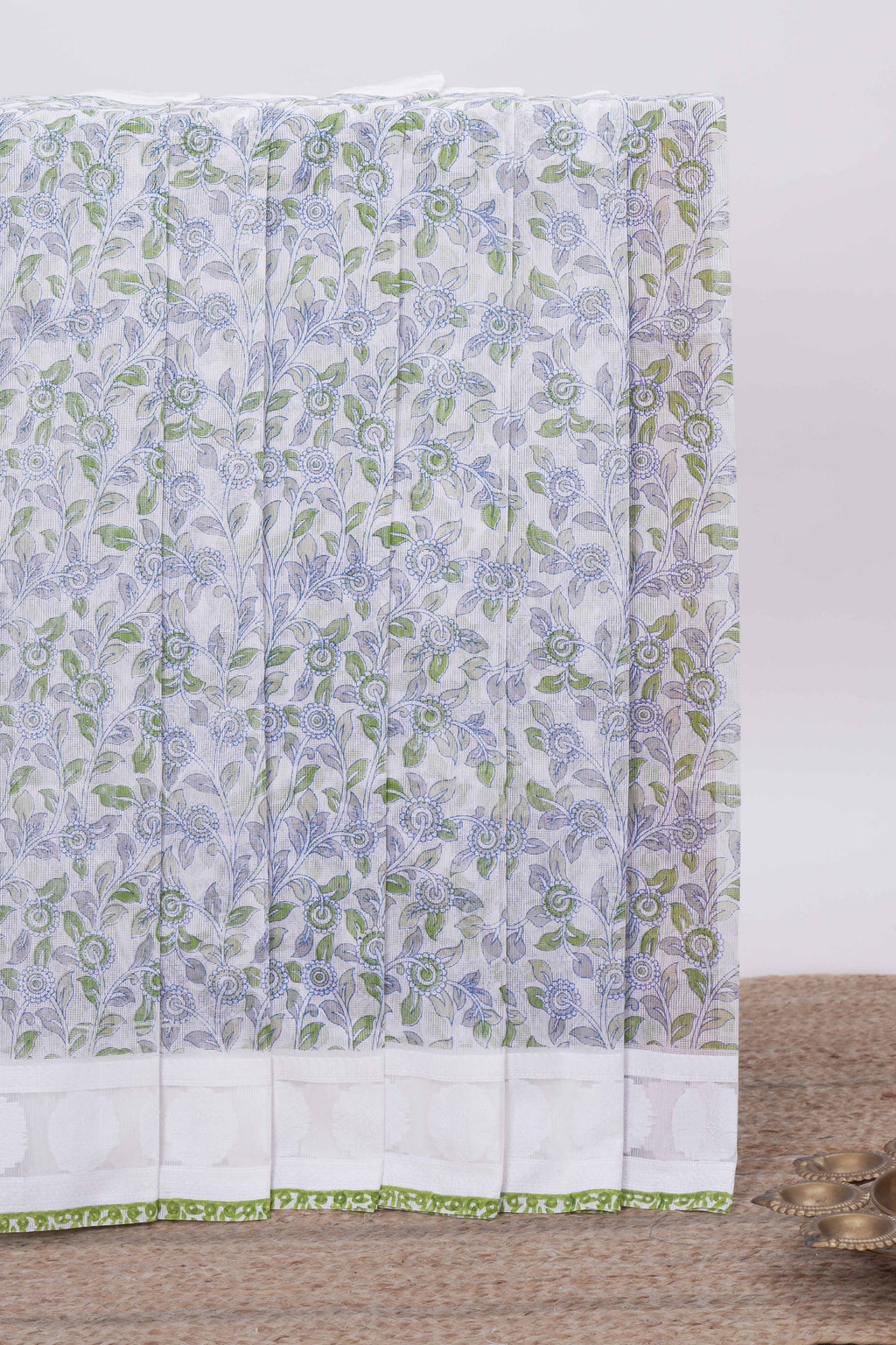 Off white floral design kota cotton saree with self border and matching motifs blouse