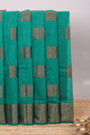Green geometric zari motifs design kota cotton saree with self zari border and matching motifs blouse