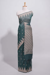 Dark green kotta cotton saee with gold zari buttas a zari border with temple design and zari woven pallu with matching blouse piece
