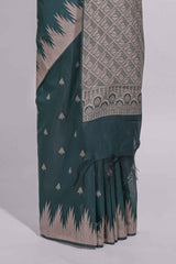 Dark green kotta cotton saee with gold zari buttas a zari border with temple design and zari woven pallu with matching blouse piece
