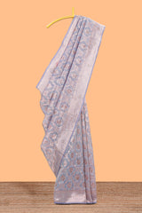 Powder blue floral motifs design kota cotton saree with self zari border and contrast blouse