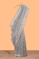 Powder green floral motifs design kota cotton saree with self zari border and contrast blouse