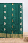 Green floral zari motifs kota cotton saree with self zari border and contrast blouse
