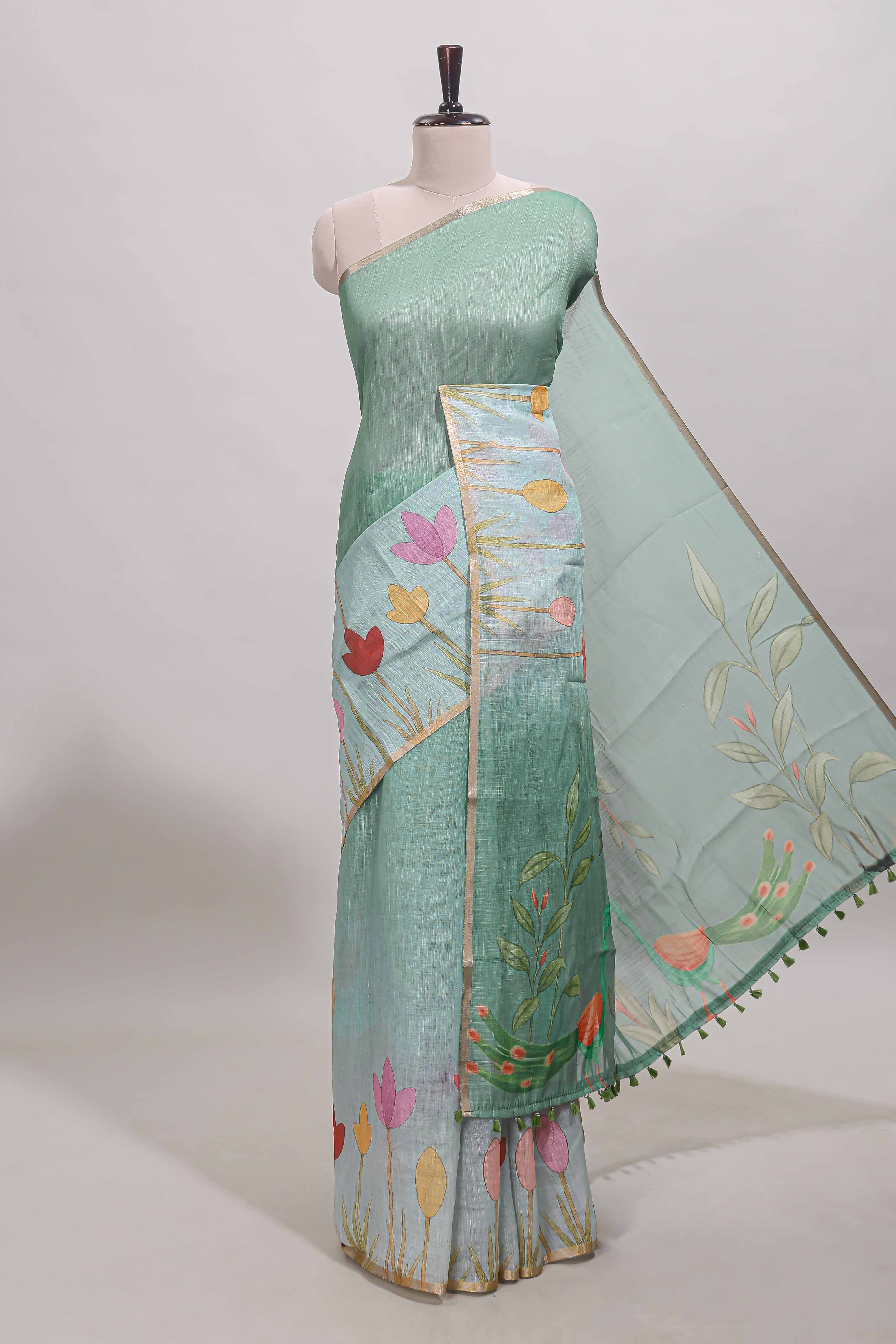 Green floral design linen cotton saree with self zari border and matching blouse