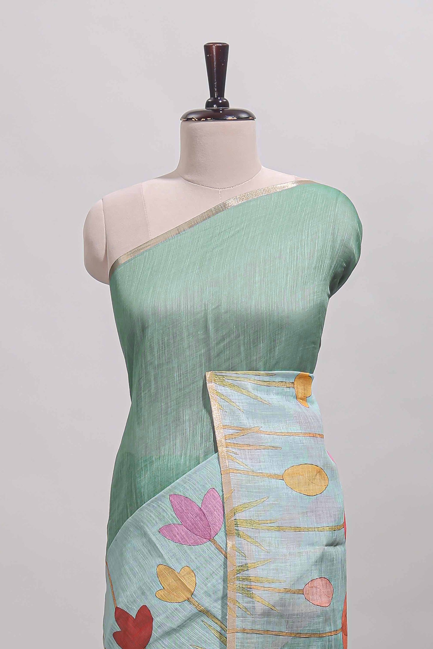Green floral design linen cotton saree with self zari border and matching blouse