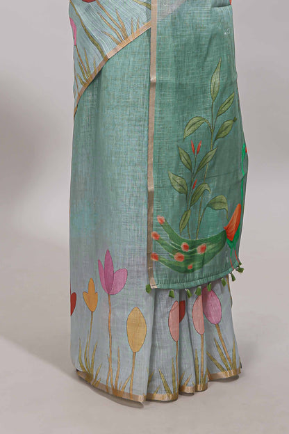Green floral design linen cotton saree with self zari border and matching blouse