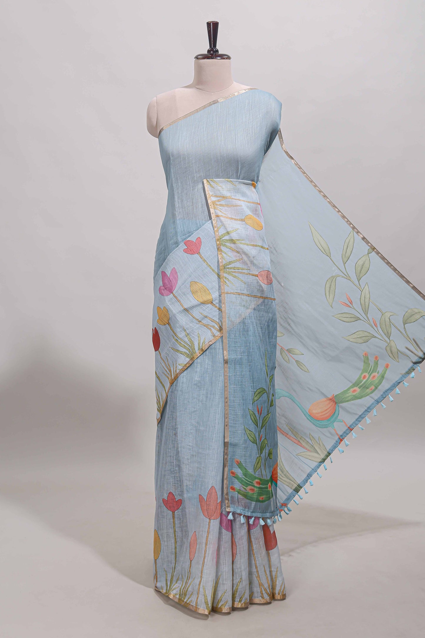 Blue floral design linen cotton saree with self zari border and matching blouse