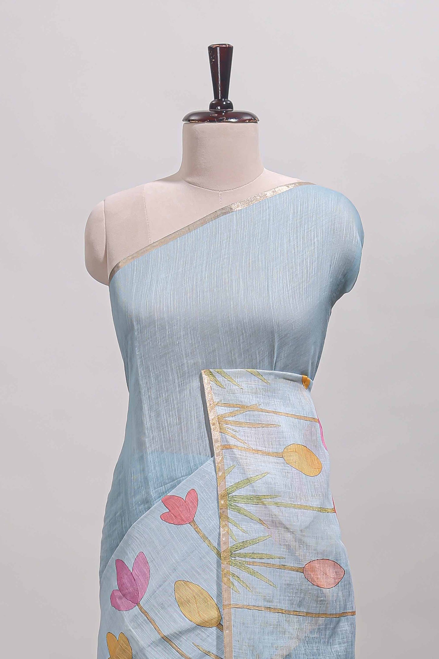 Blue floral design linen cotton saree with self zari border and matching blouse