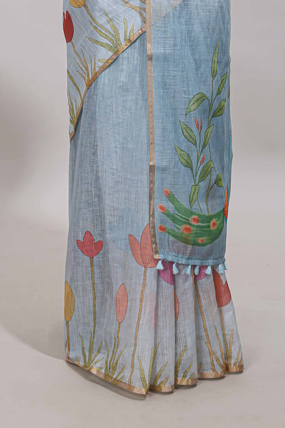 Blue floral design linen cotton saree with self zari border and matching blouse