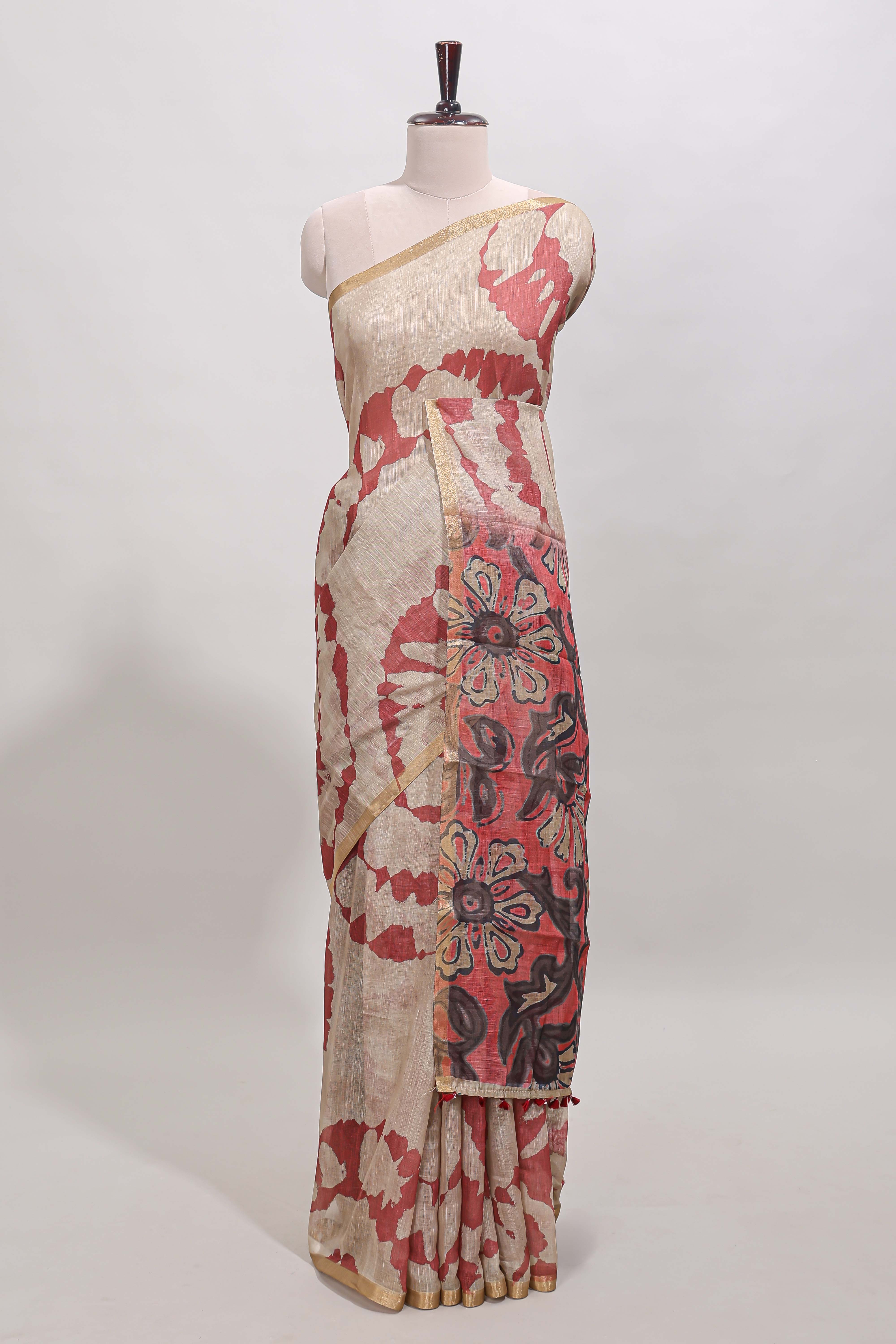 Beige linen cotton saree with red shibori print, self zari border and floral design pallu
