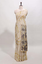 Beige linen cotton saree with yellow shibori print, self zari border and floral design pallu