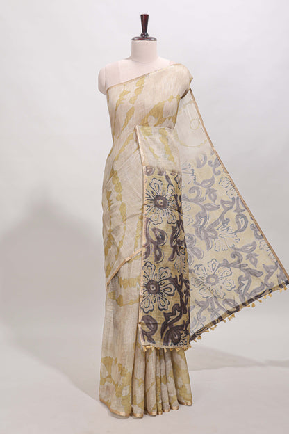 Beige linen cotton saree with yellow shibori print, self zari border and floral design pallu