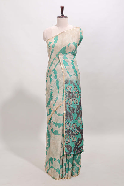 Beige linen cotton saree with green shibori print, self zari border and floral design pallu