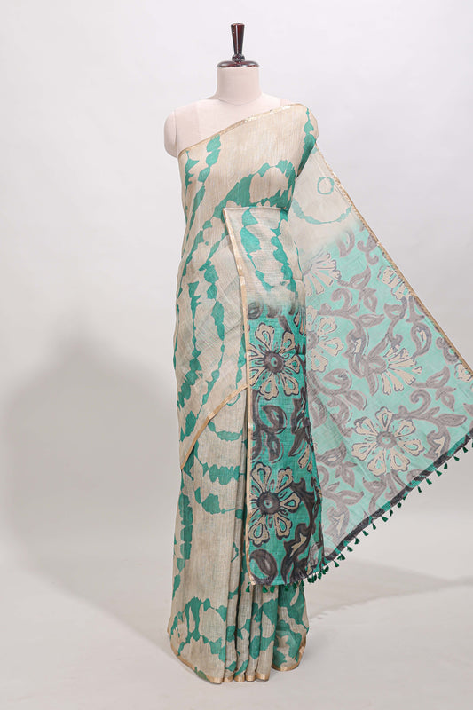 Beige linen cotton saree with green shibori print, self zari border and floral design pallu