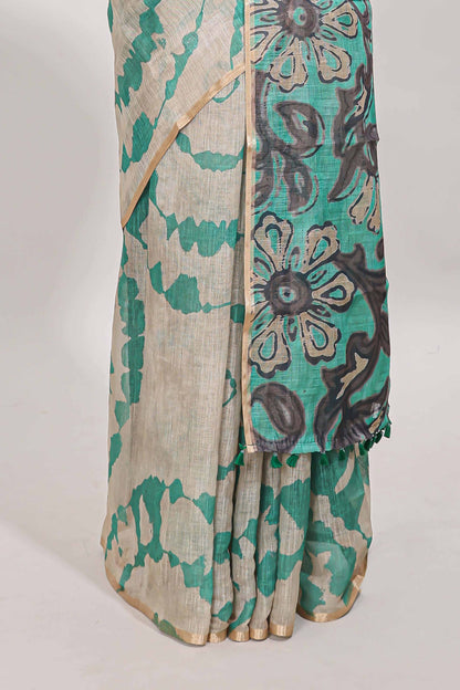 Beige linen cotton saree with green shibori print, self zari border and floral design pallu