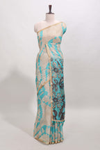 Beige linen cotton saree with blue shibori print, self zari border and floral design pallu