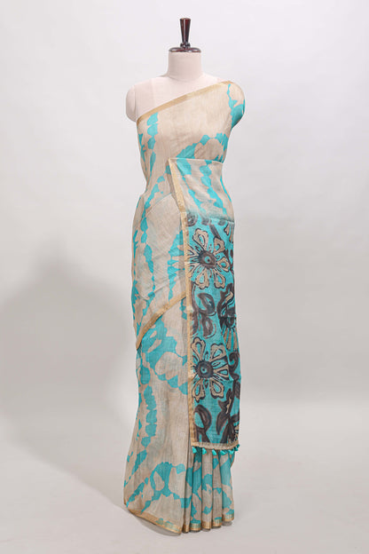 Beige linen cotton saree with blue shibori print, self zari border and floral design pallu