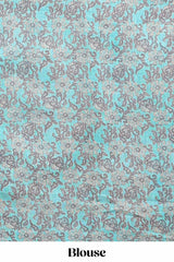 Beige linen cotton saree with blue shibori print, self zari border and floral design pallu