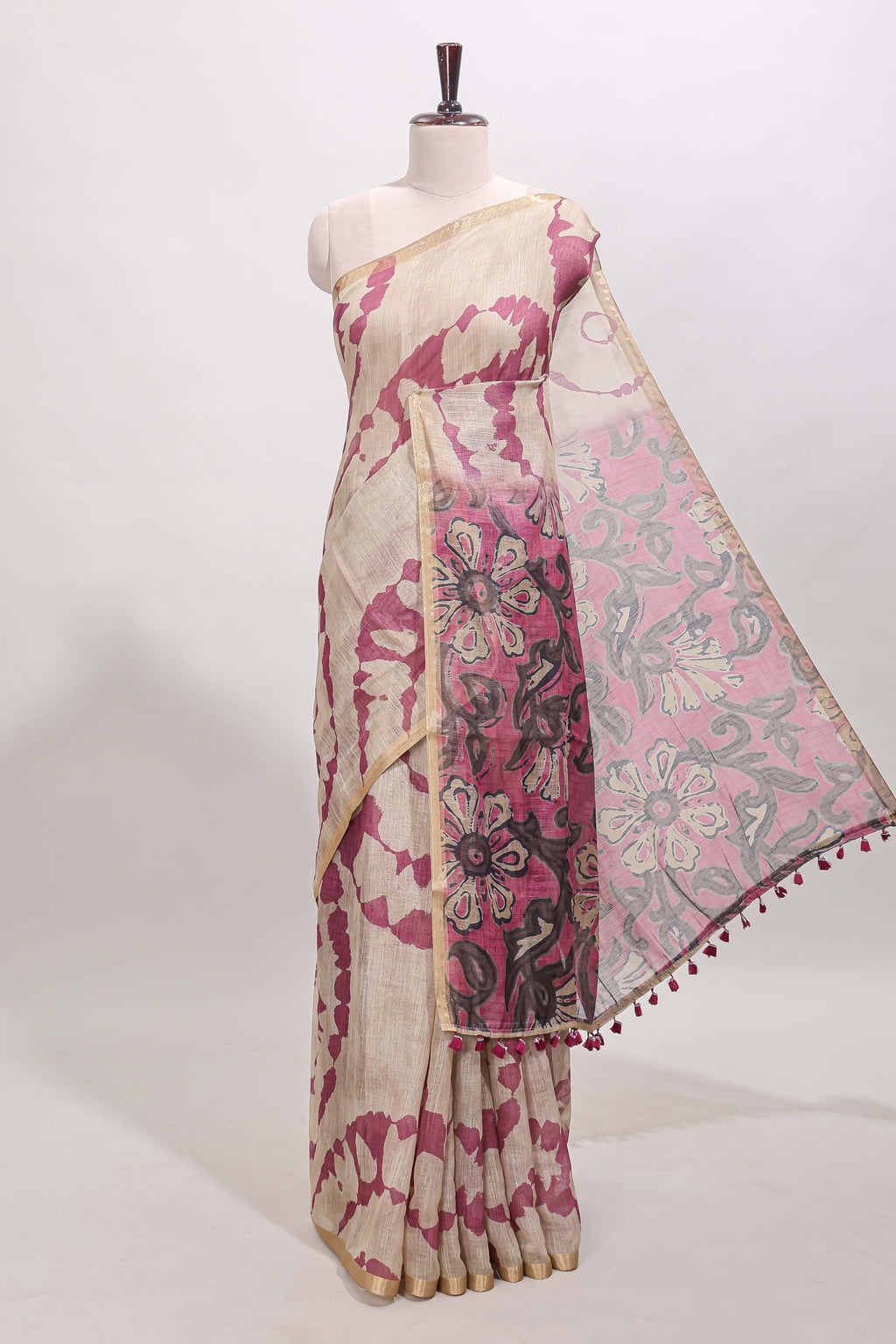 Beige linen cotton saree with purple shibori print, self zari border and floral design pallu