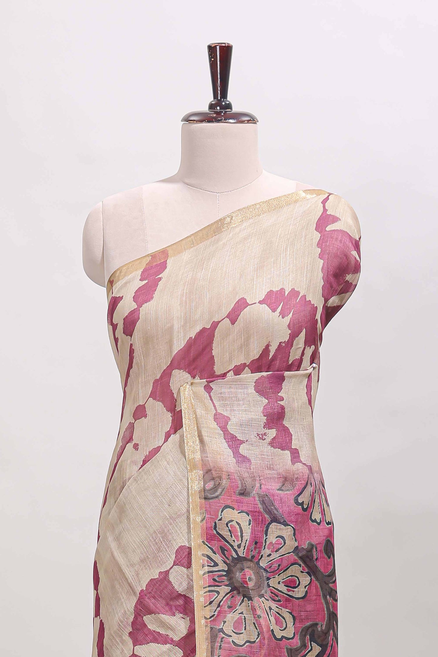 Beige linen cotton saree with purple shibori print, self zari border and floral design pallu