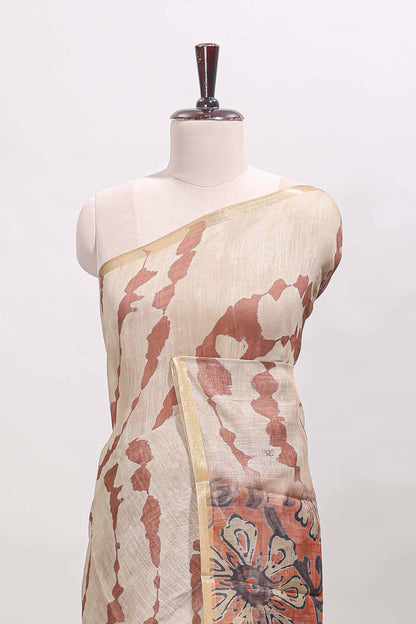 Beige linen cotton saree with brown shibori print, self zari border and floral design pallu